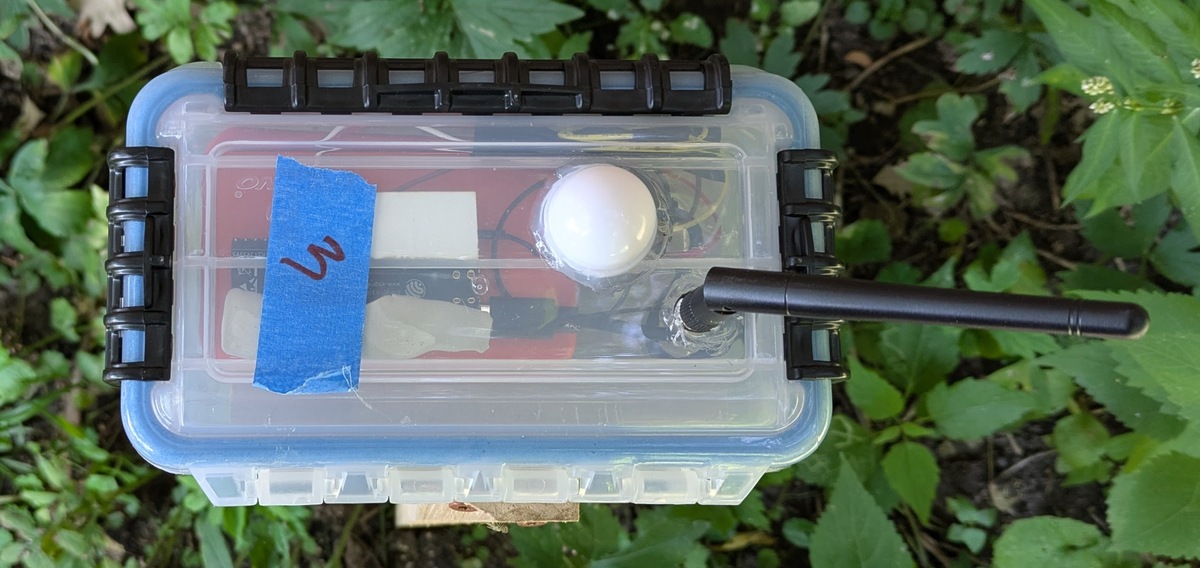 A top-down view of a white, rectangular prototype enclosure for a light sensor.
