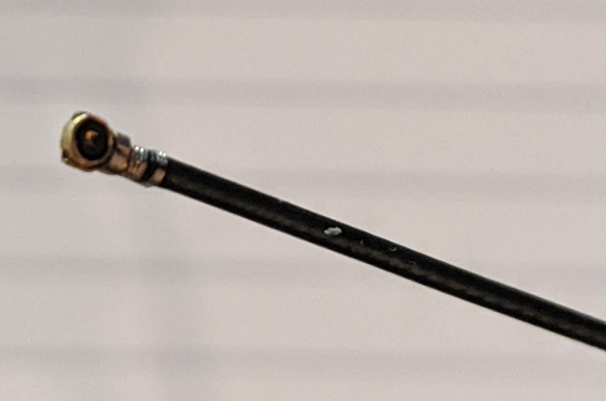 A close-up photo of the incorrect antenna pigtail connector which does not fit the ESP32 board.